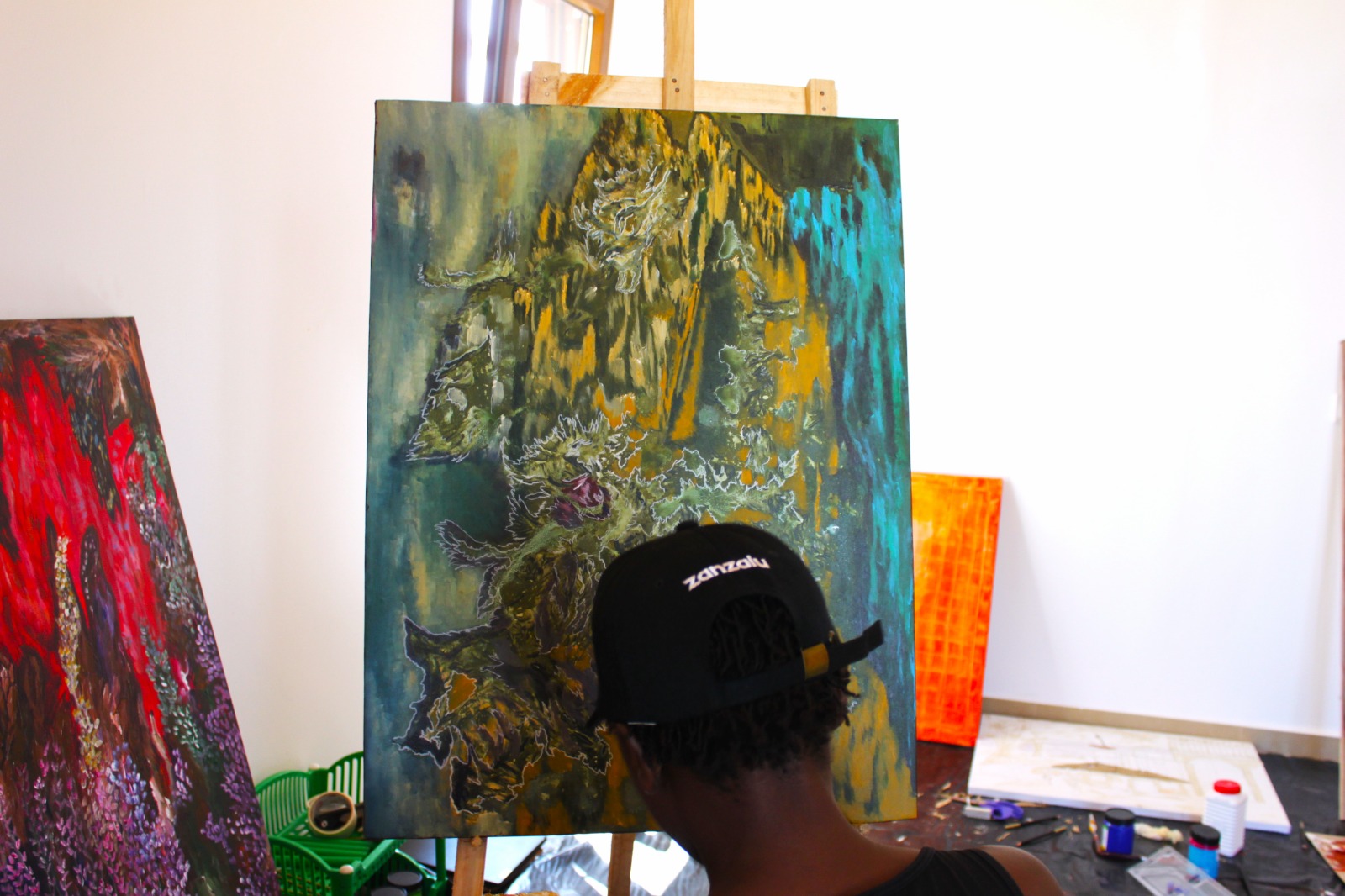 Artist studio acrylic pigments and works in progress